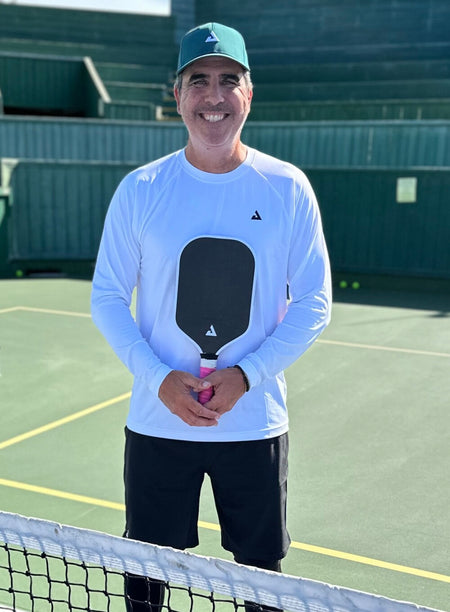 Headshot image of JOOLA Pickleball pro Dayne Gingrich posing on the pickleball court with his JOOLA MOD TA-15 pickleball paddle.