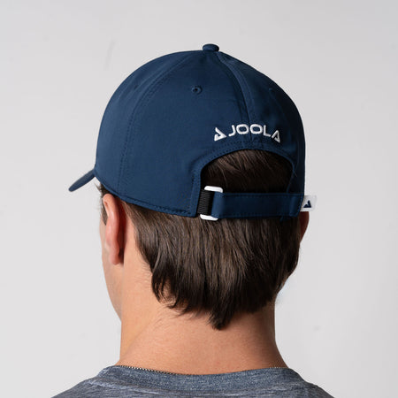 A view showing a male model wearing a JOOLA Essential Cap, Navy.