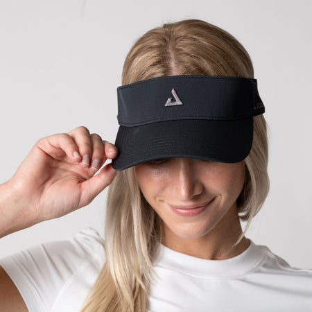 Female model showing off the JOOLA Essential Visor, black.