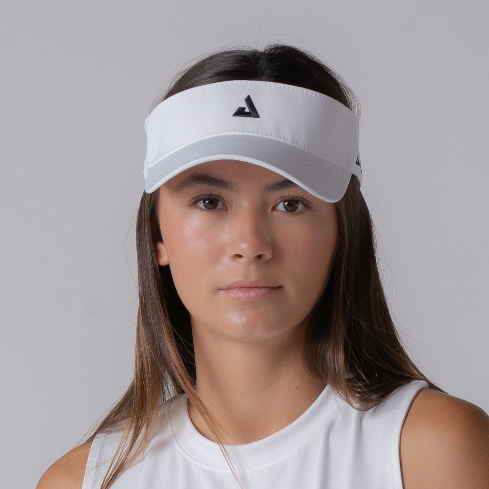 Image of a female model wearing a JOOLA Essential Visor, white.