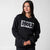 Graybackground, image of a female model wearing a JOOLA Fleece Crew, Black.