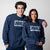 Gray background, two models wearing matching JOOLA Fleece Crew, Navy.