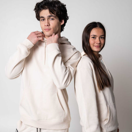 Gray background, two models wearing matching JOOLA Fleece Hoodies.