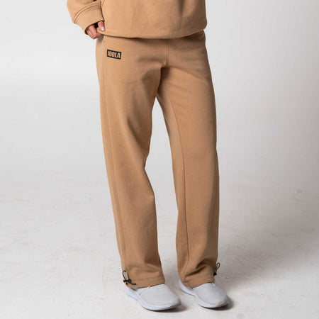 Gray background, image of a pair of JOOLA Fleece Pants, latte.