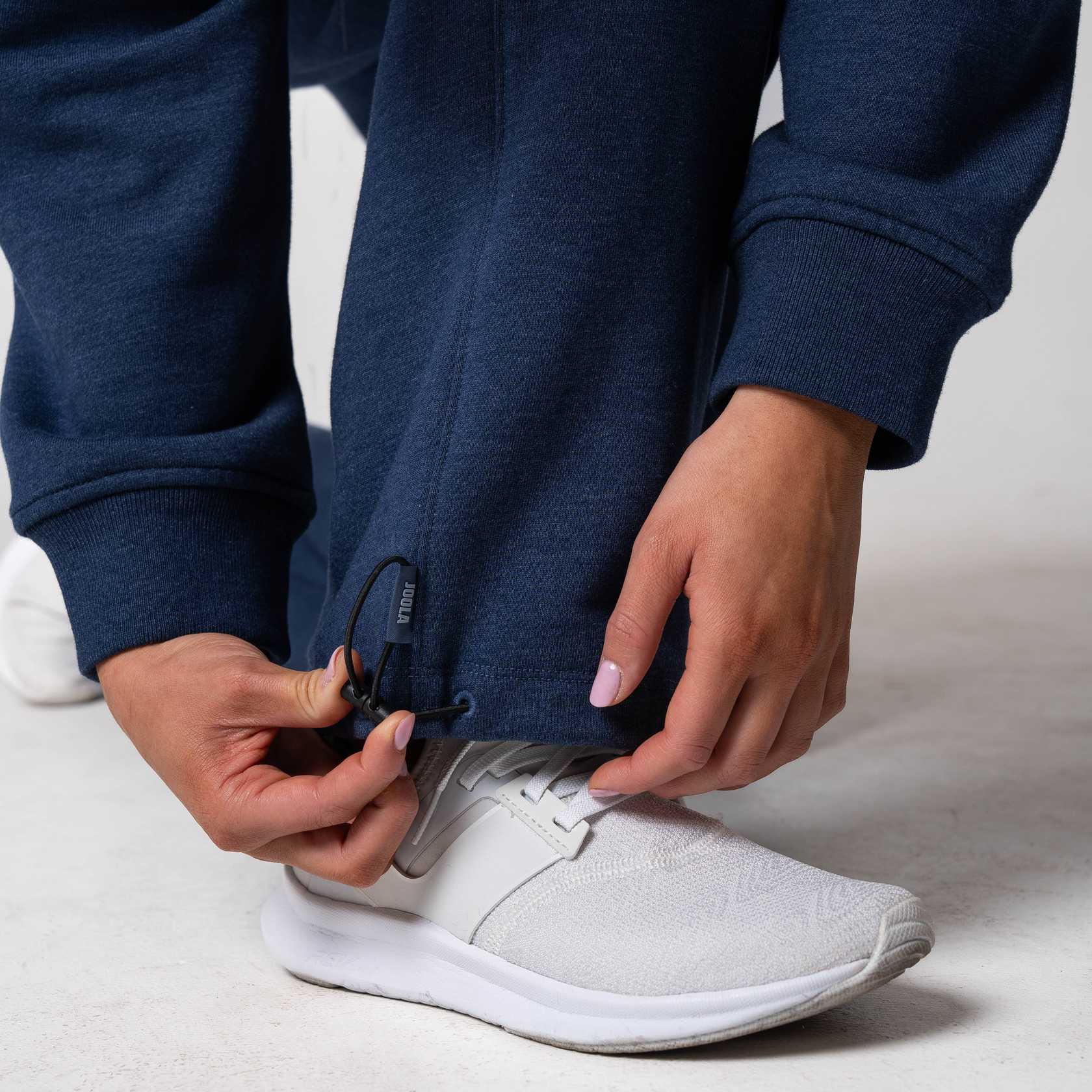 Close up on the bottom pant cuff of the JOOLA Fleece Pants, Navy.
