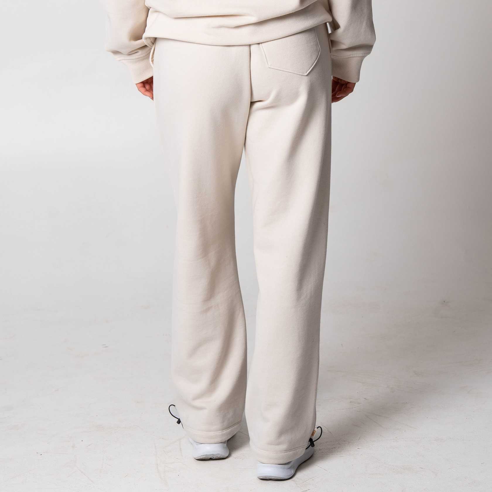 Gray background, image of a pair of JOOLA Fleece pants on a model.