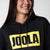 Close up on the yellow and black JOOLA logo on the front of a JOOLA graphic hoodie, black and yellow.