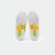 White background, product image showing the bottom of a pair of JOOLA TT SM4SH pickleball shoes, with yellow and green carbon shank.