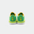 White background, product image of the JOOLA TT SM4SH table tennis, green, yellow and white colorway. Image shows the back of a pair of the shoes, with JOOLA logo lock up.