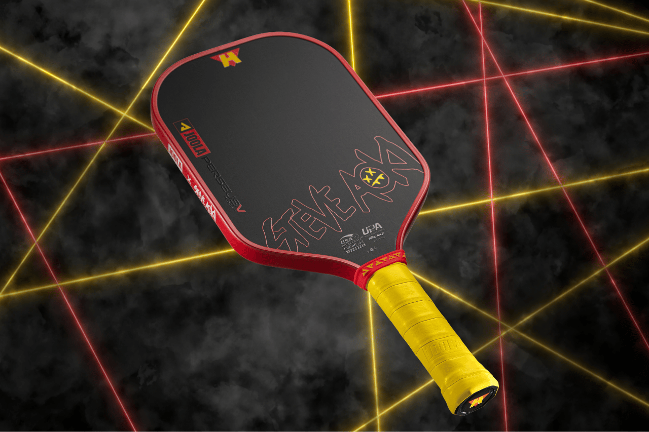 Image of the JOOLA x Steve Aoki pickleball paddle, yellow handle, red edge guard and the Steve Aoki logo across the front.
