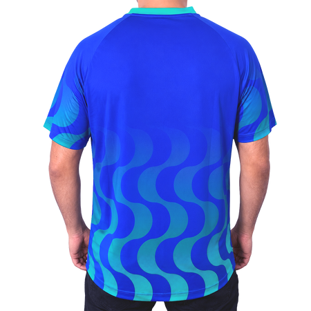 White background, product image showing the rear view of a male model wearing an Azul  colored Hugo Calderano Copacabana Raglan Short Sleeve.