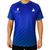 White background, image of a male model wearing a Hugo Calderano Monogram Crossover Raglan Short Sleeve shirt, Azul.