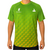 White background, image of a male model wearing a green and yellow, Hugo Calderano Monogram Crossover Raglan Short Sleeve shirt.