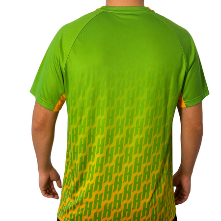 White background, image showing the back of a male model wearing a Hugo Calderano Crossover Raglan Short Sleeve shirt, jungle green colorway.