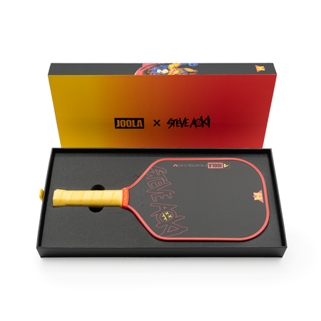 White background, product image showing the Perseus Pro V JOOLA x Steve Aoki pickleball padle in it's premium, HIROQUEST packaging.