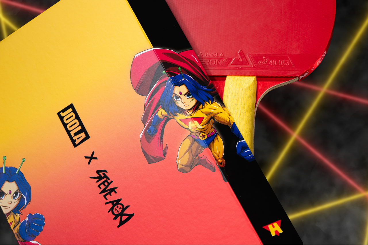Close up image of the JOOLA x Steve Aoki Hiroquest Table Tennis packaging with image of the racket in the background.