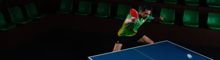 Hero image of JOOLA Table Tennis pro Hugo Calderano returning the table tennis ball.