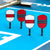 Four Agassi pickleball paddles on a blue surfaced pickleball court.