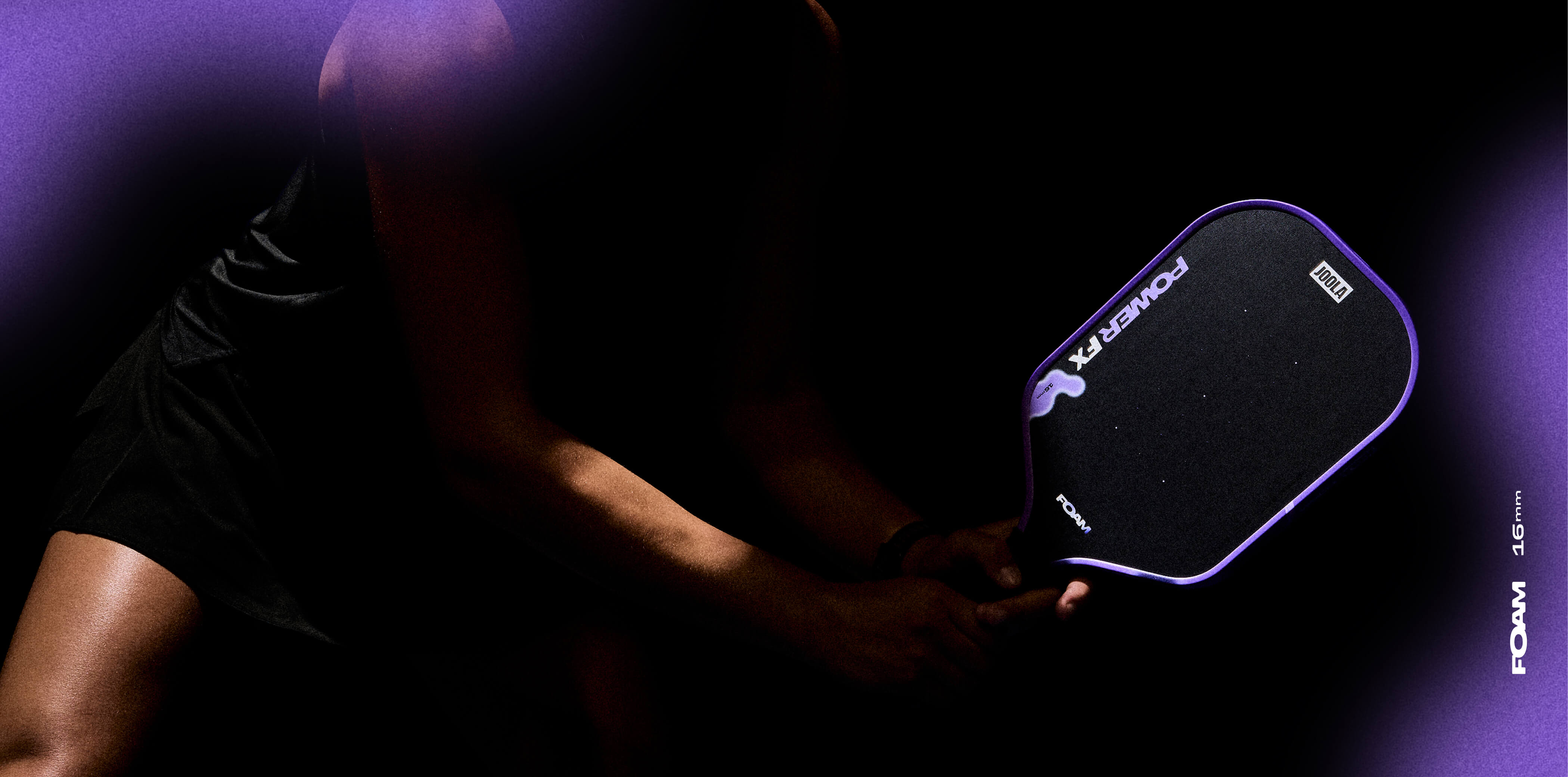 Dark background, with the purple paddle peaking out, JOOLA POWER FX Mischief pickleball paddle header image. 