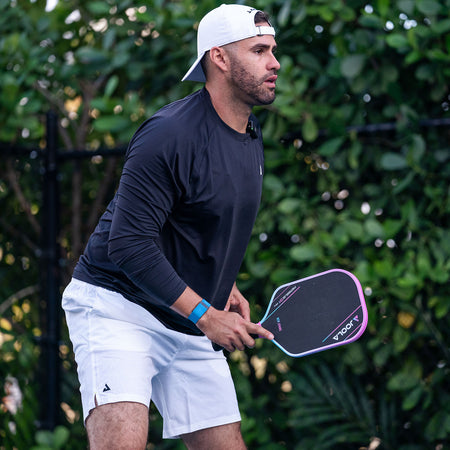 Image of MLB All-Star J.D. Martinez on a pickleball court with a JOOLA Pink Perseus 3S.