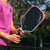 Close up image of the JOOLA Pink Perseus in the hands of a player.