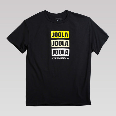 Gray gradient background, product image of a black JOOLA Stacked Logo graphic tee.