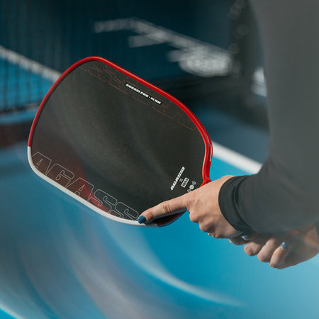 Close up image of the Agassi x JOOLA Agassi Pro Pickleball paddle in the hands of a JOOLA pro pickleball player.