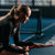 Close up image of Brooke Buckner sitting down and feeling the surface of the Agassi x JOOLA Agassi Pro Pickleball Paddle.