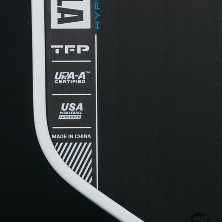 Close up image of the dual-certification on the surface of the JOOLA Ben Johns Hyperion Pro IV Pickleball Paddle, 14mm.