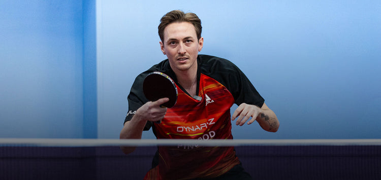 Horizontal banner image of Liam Pitchford playing table tennis.