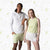 Serpentine pattern background, a female and male model posing in JOOLA Spring 2025 apparel.