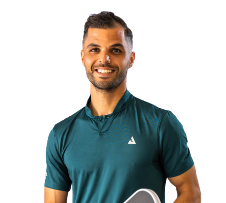 JOOLA Pro Mota Alhouni dressed in a green JOOLA Polo and holding a JOOLA Perseus Pro IV.