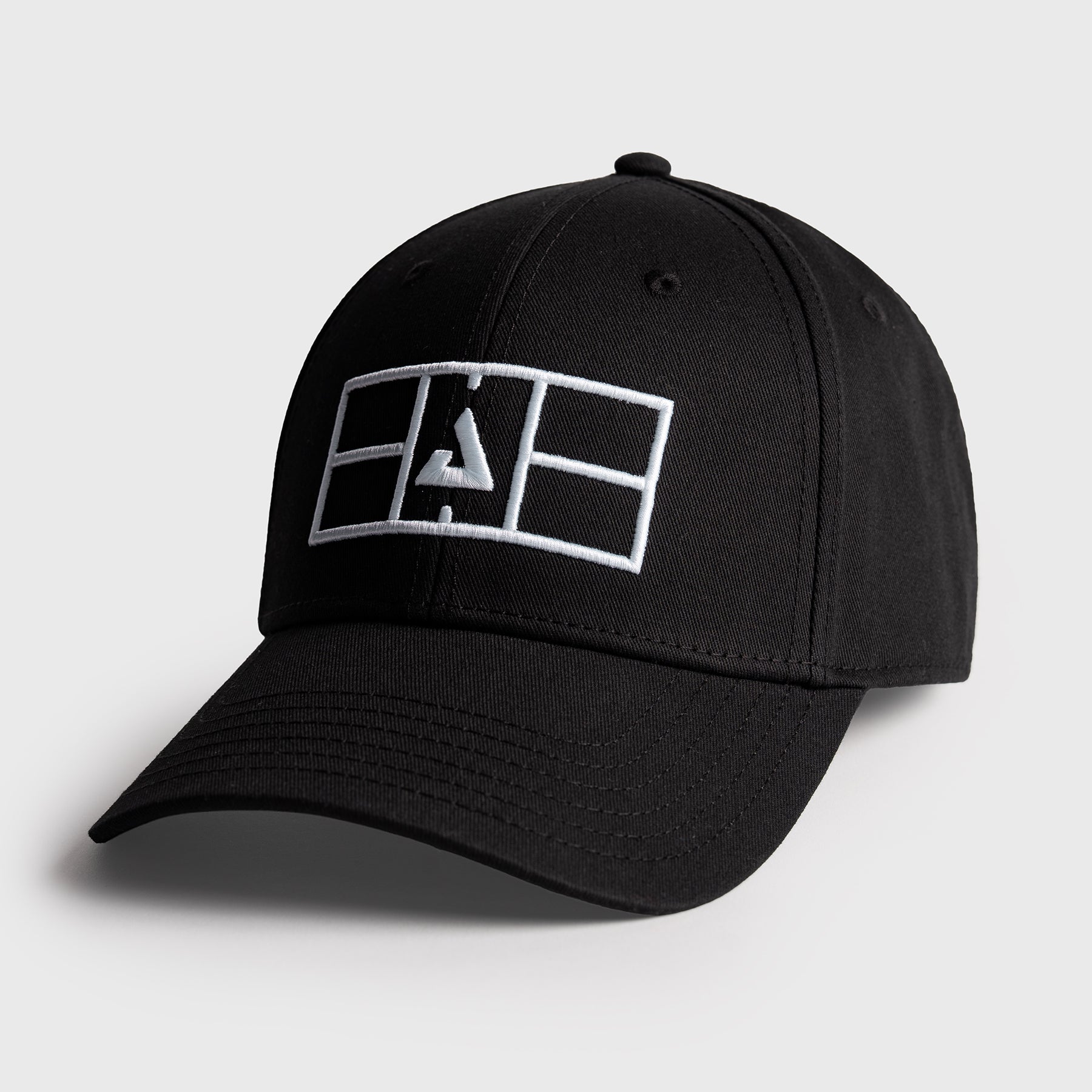 Black JOOLA Court hat with a gray background.
