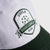 White and green JOOLA Collegiate cap with pickleball club logo on a light gray background