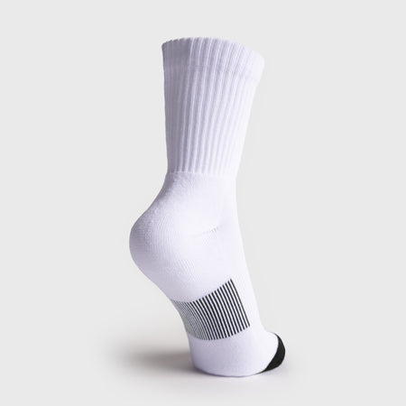 A single white JOOLA crew sock shown from the side on a light gray background, featuring a ribbed cuff, a black-and-white striped heel section, and a black toe cap.