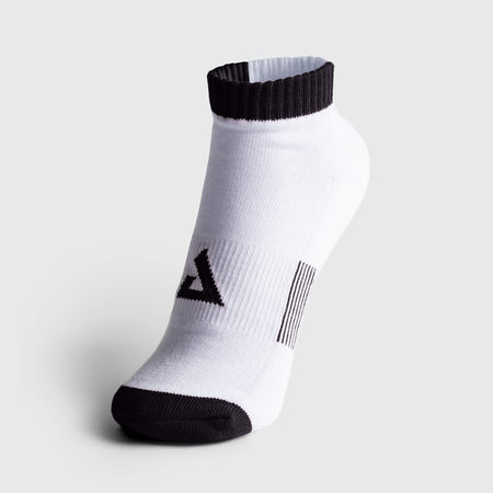 A single JOOLA white low-cut athletic sock with black accents on the toe, heel, and ribbed ankle cuff, featuring a black geometric logo on the side, set against a light gray background.