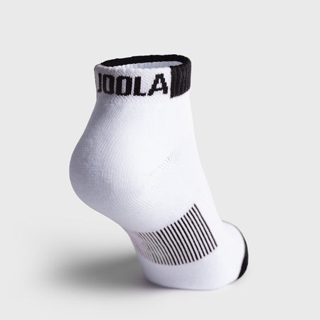 A single white ankle-length athletic sock with black trim, featuring the brand name 'JOOLA' in black on the cuff and a black striped compression zone on the heel, shown against a light gray background.
