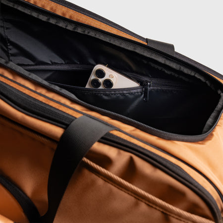 Image of the hidden compartment in the JOOLA latte colored Pro Pickleball Tour bag.
