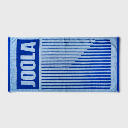 White background, blue and white JOOLA towel.