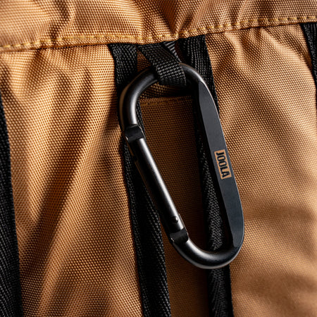 Close up of the JOOLA carabiner hook hanging from a JOOLA Latte colored Pro Pickleball Tour bag.