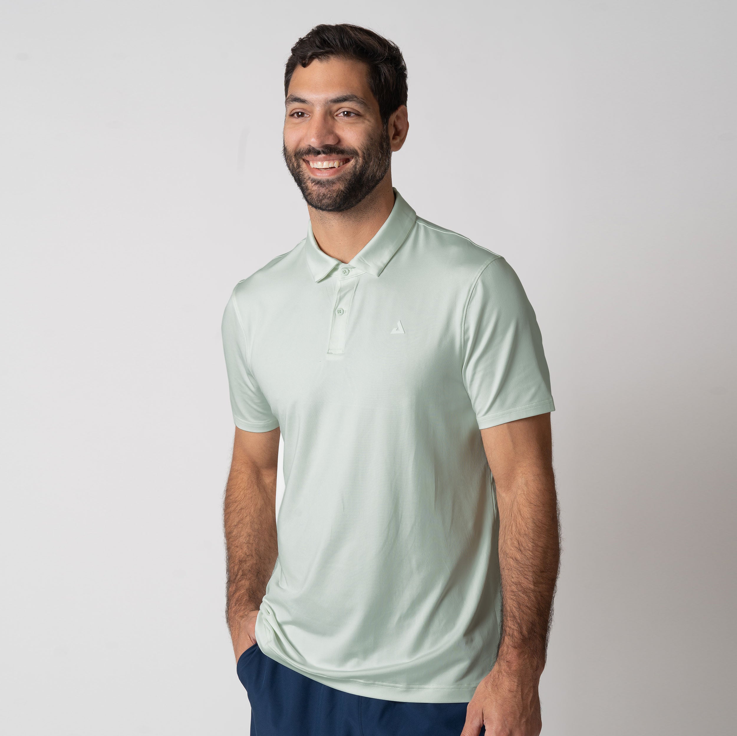 Male model wearing the JOOLA Men's Club Polo, Hushed Mint.