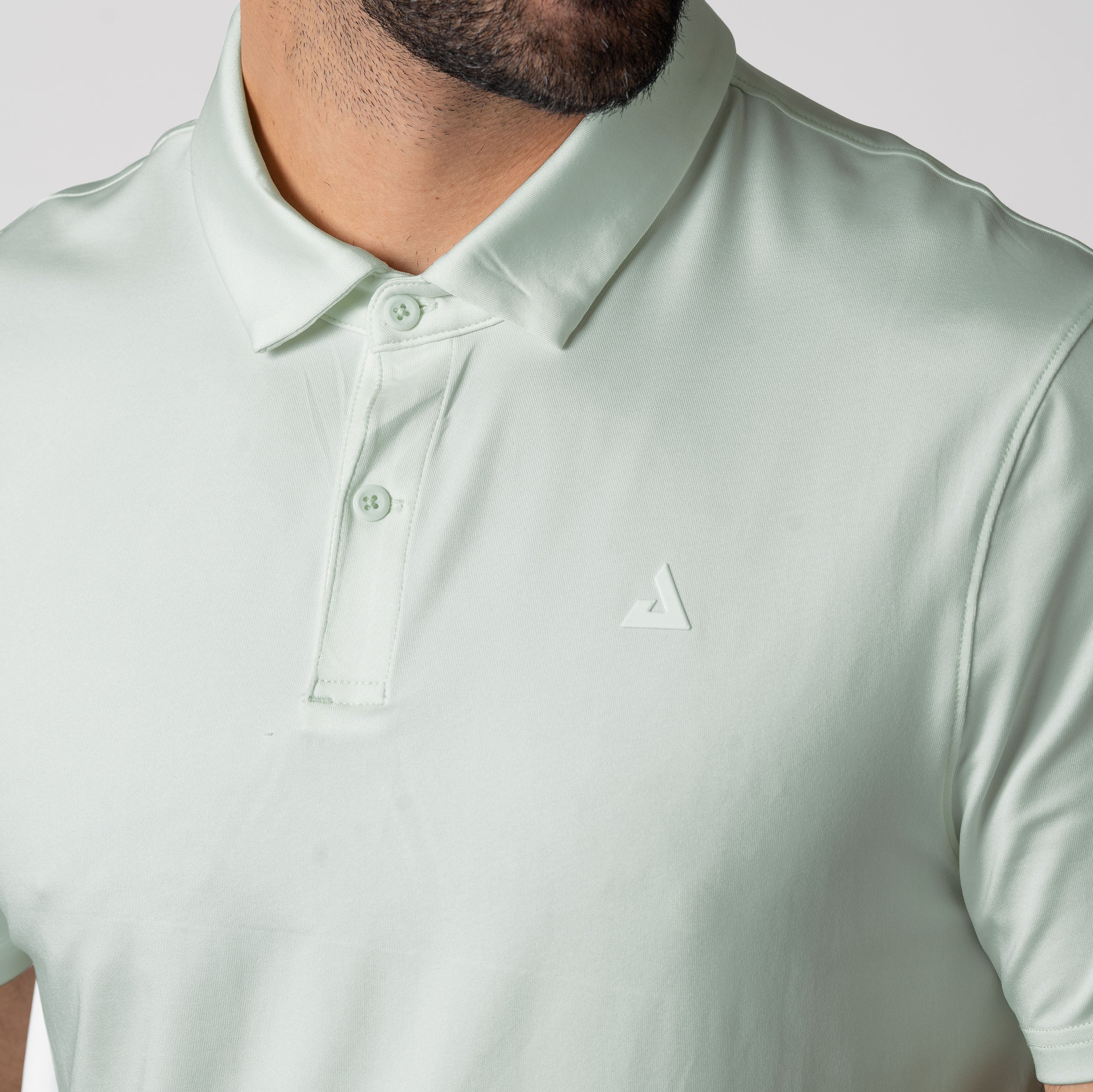 Close up image of the JOOLA men's club polo, hushed mint.