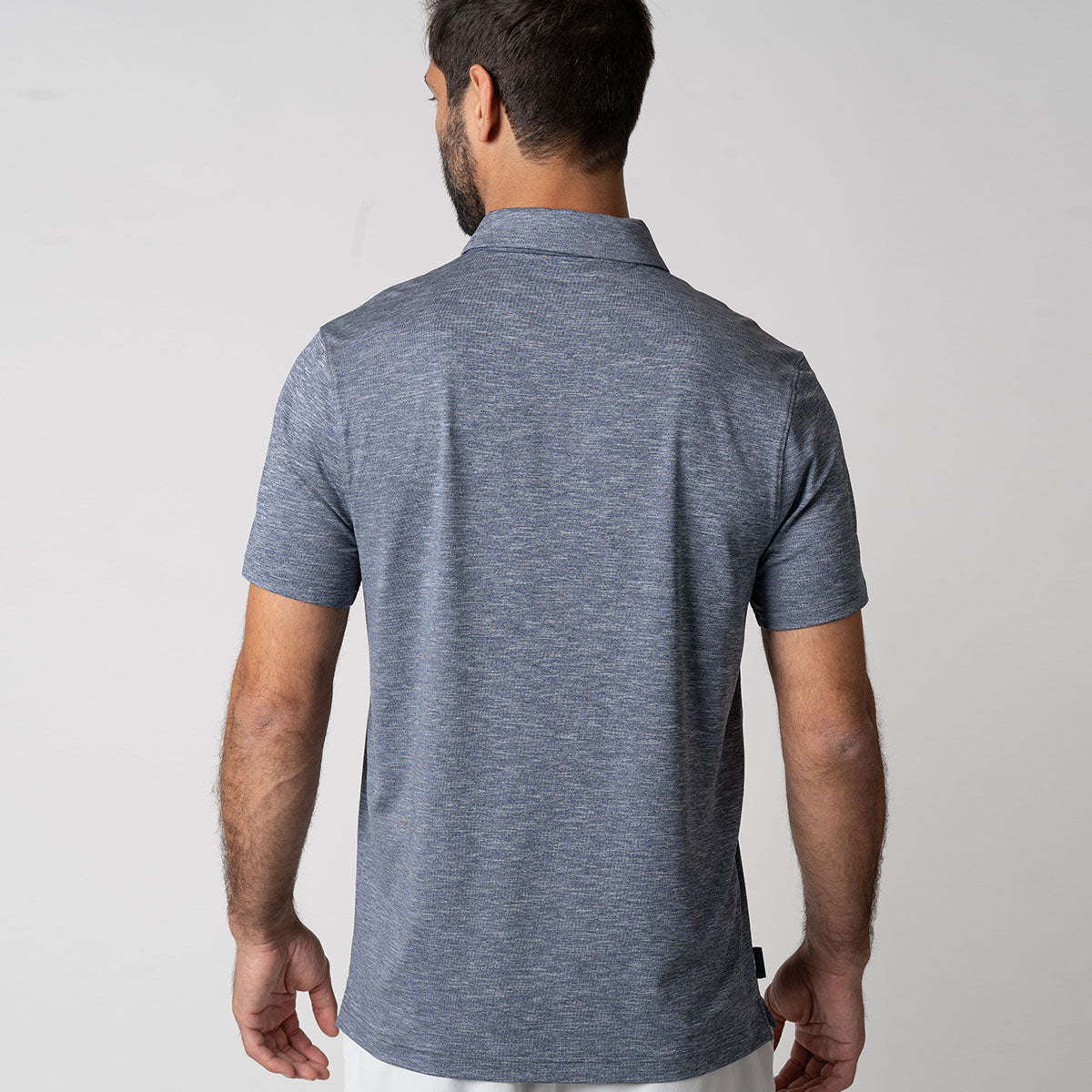 Image of the back side of the JOOLA Men's Club Polo, Navy Heather. The modern self-fabric collar with no topstitch is featured.