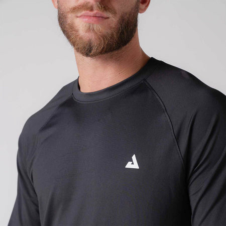 Close up image of male model wearing the JOOLA Men's Court Long Sleeve shirt, black.