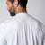 Image showing the back of a male model wearing a men's court polo, white.