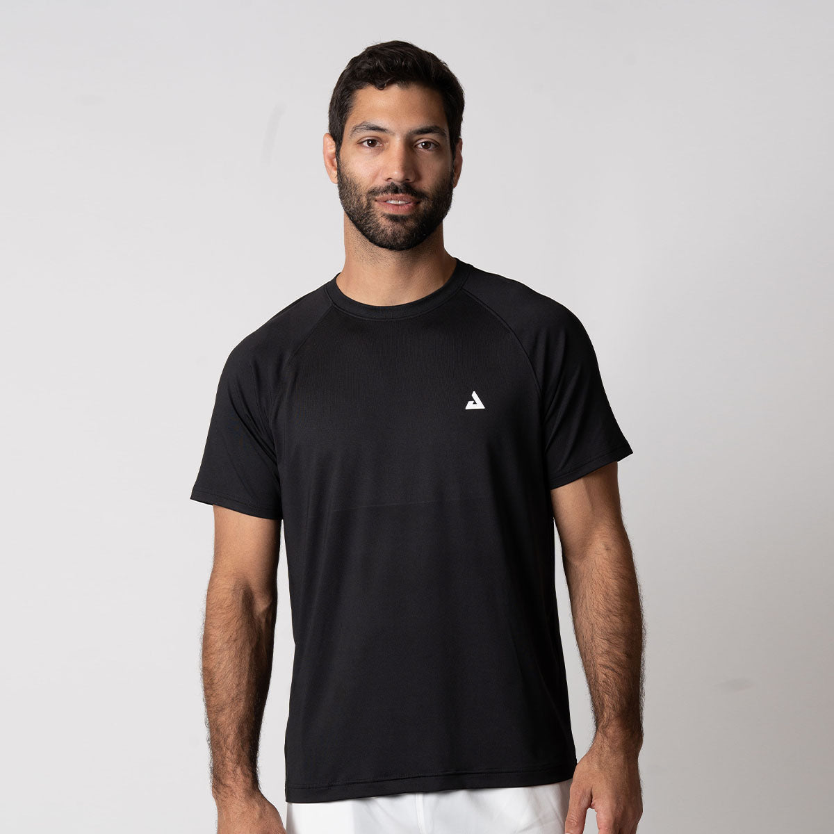 Image of a male model wearing a JOOLA Men's Court Short Sleeve Shirt, Black.