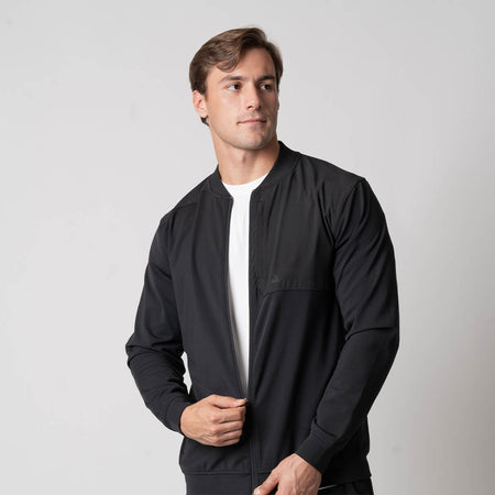 Image of a male model wearing a JOOLA Men's Warm Up Jacket, Black.