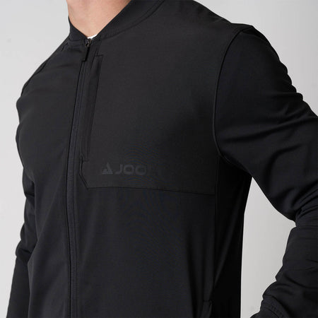 Close up image of the JOOLA Men's Warm Up Jacket, showing the JOOLA Logo, black.