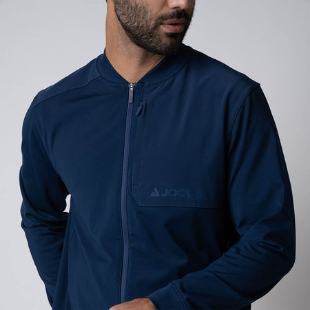 Close up image of the JOOLA Men's Warm Up Jacket, highlighting the JOOLA logo over the left chest, navy.