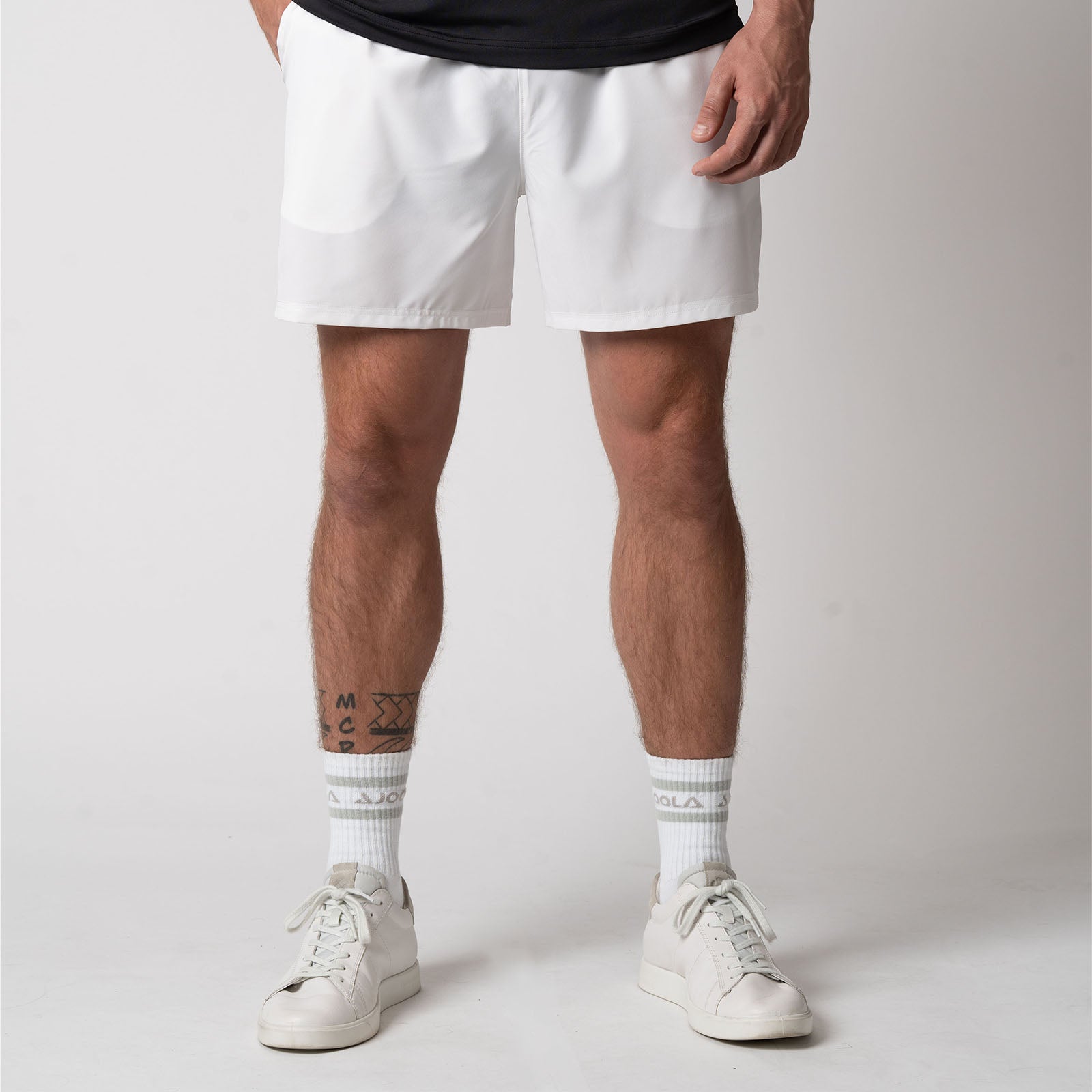 Image of a male model wearing a pair of JOOLA Men's Woven Shorts, White.